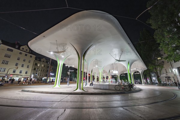 Modern bus stop with striking lighting and structural design elements, Munich, Germany