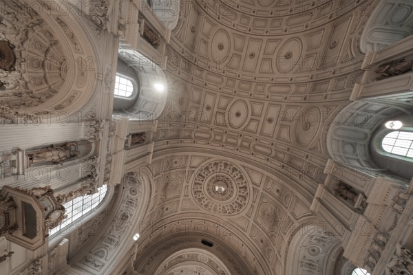 Magnificent domed ceiling of a historic church with baroque decorations, Munich, Germany