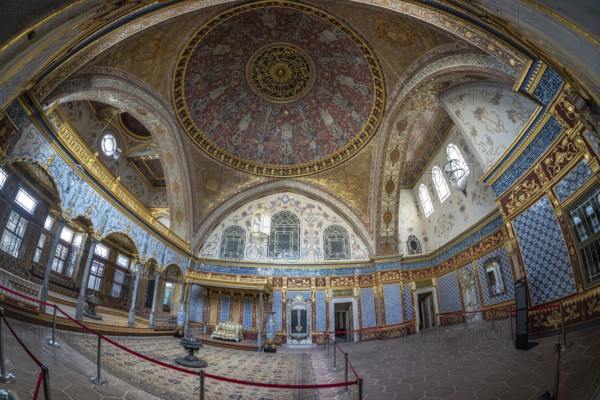 Wide angle view of the richly decorated interior of topkapi palace, showcasing intricate ottoman architecture and design