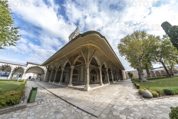 Wide angle view of the decorated audience chamber and the tower of justice, inside the topkapi palace museum in istanbul, turkey