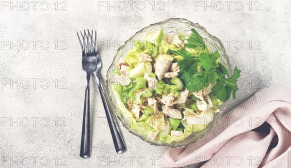 Waldorf salad, celery salad with apple, in a glass salad bowl, natural light, homemade, no people