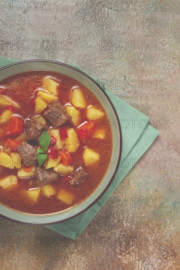 Meat goulash, with potatoes and carrots, sweet pepper, traditional Hungarian soup, homemade, no people