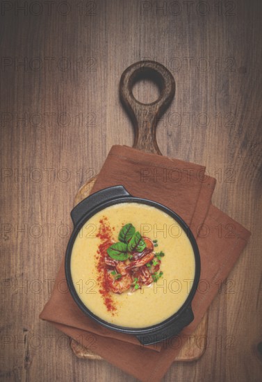 Pumpkin cream soup with shrimp, herbs and spices, homemade, no people