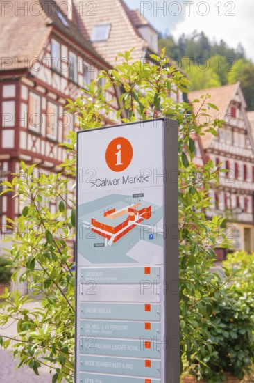 Information sign of the Calw market in front of sunny half-timbered houses, small town of Perle Calw, Black Forest, Germany