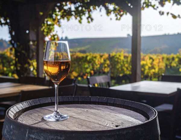 Glass of 10-year-old tawny wine placed on a barrel in a vineyard restaurant, AI generated
