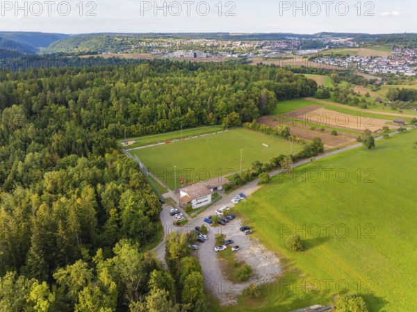 Large sports field surrounded by fields and forest, close to a larger village, VFL Stammheim, Calw, Black Forest, Germany