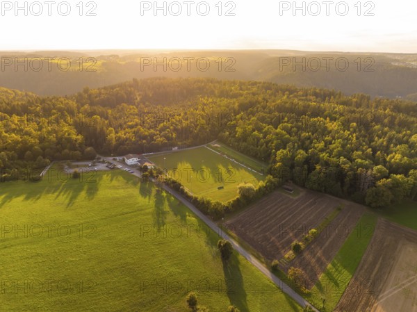 Fields and forest in the light of the sunset with long shadows, VFL Stammheim, Calw, Black Forest, Germany