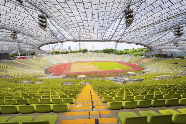 View from above of a stadium with empty stands and a wide playing field, Olympiapark, Munich, Germany
