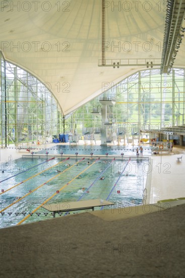 Spacious indoor swimming pool with large window fronts that let in plenty of light, Olympiapark, Munich, Germany