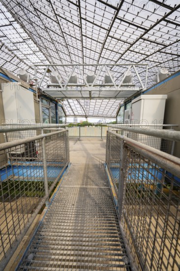 Metal grid access to part of the stadium under a large roof, Olympiapark, Munich, Germany