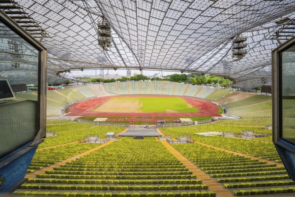 Stadium view from above with empty stands and central pitch, Olympiapark, Munich, Germany