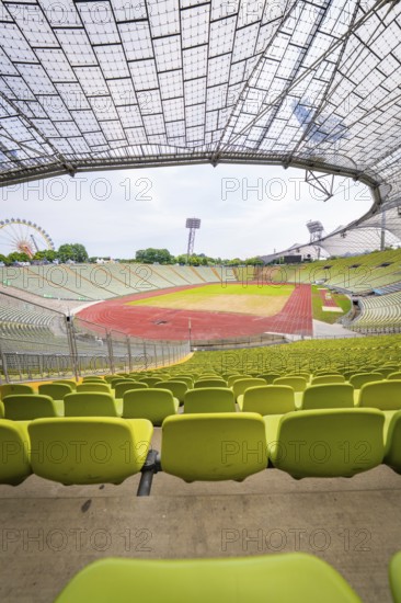 Empty modern stadium with central view of running track and striking glass architecture, Olympiapark, Munich, Germany