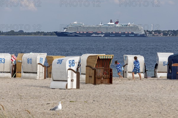 Cruise ship Mein Schiff 7, Laboe, Kiel Fjord, in front beach chairs on the beach of Strande, Schleswig-Holstein, Germany