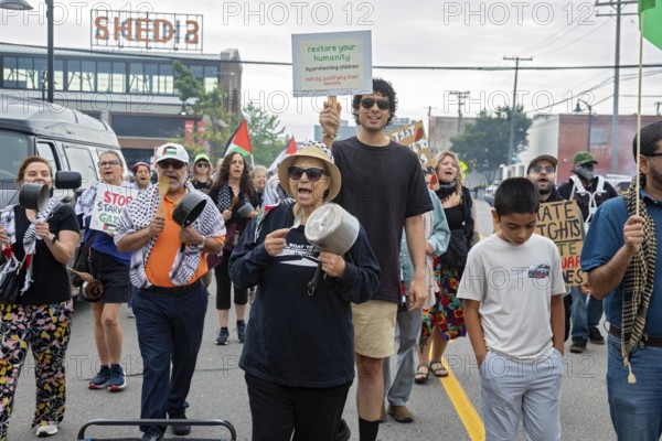 Detroit, Michigan USA - 23 August 2025 - Protesters rally at Eastern Market, banging empty pots to protest starvation in Gaza