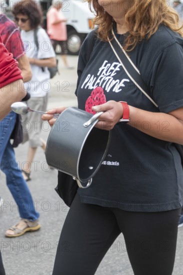 Detroit, Michigan USA - 23 August 2025 - Protesters rally at Eastern Market, banging empty pots to protest starvation in Gaza