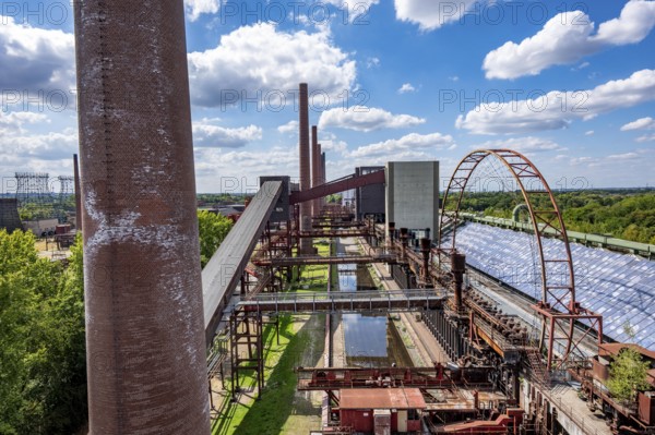 The Zollverein coking plant, backdrop to the once largest central coking plant in Europe, closed in 1993, part of the Zollverein Coal Mine Industrial Complex UNESCO World Heritage Site, Essen, North Rhine-Westphalia, Germany