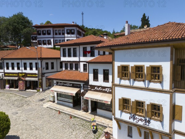 Historic old town with white buildings and red roofs, shops on a cobblestone street under a blue sky, aerial view, traditional Ottoman konaks, Safranbolu, UNESCO World Heritage Site, Karabük Province, Black Sea Region, Central Anatolia, Turkey