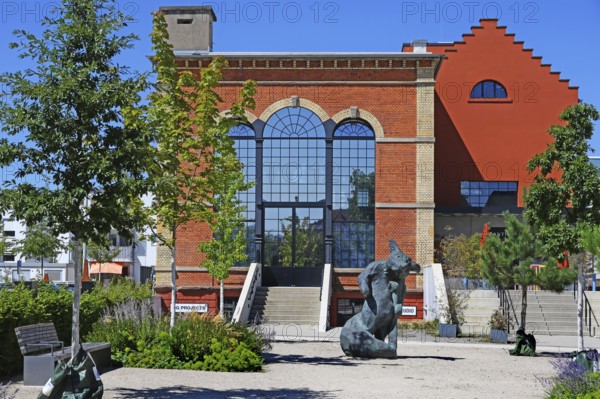 Artist's studio of the artist Stefan Strumbel in a former, historic boiler house of a brewery, in front of it a sculpture by the artist, Offenburg, Baden-Württemberg, Germany