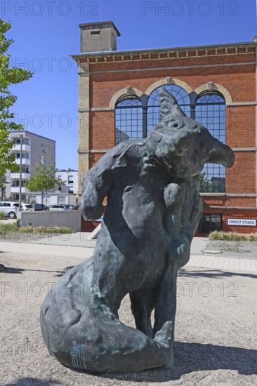 Sculpture by artist Stefan Strumbel in front of his studio, a former, historic boiler house of a brewery, Offenburg, Baden-Württemberg, Germany