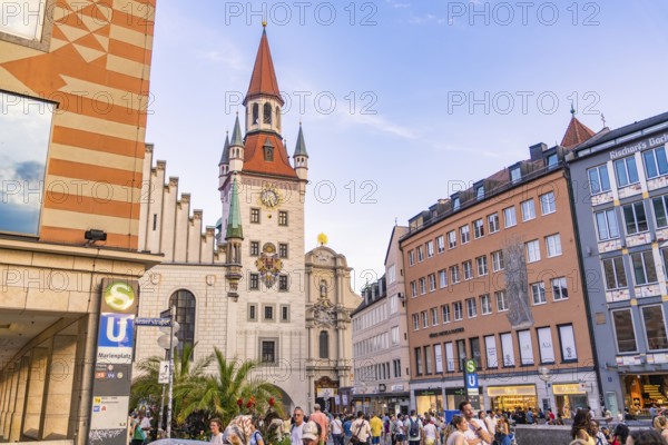 Tower and busy street in Munich with people passing by in nice weather, Munich, Germany