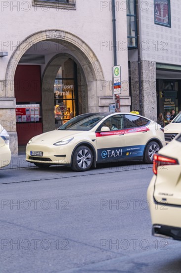 Tesla e-taxi parked in an urban environment, Munich, Germany