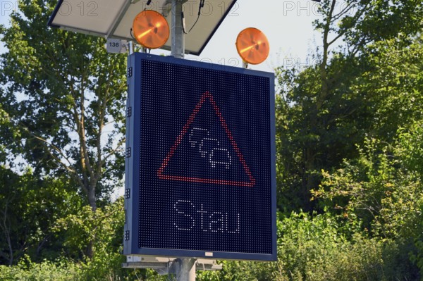 Traffic sign with solar-powered traffic jam warning on the motorway, Baden-Württemberg, Germany