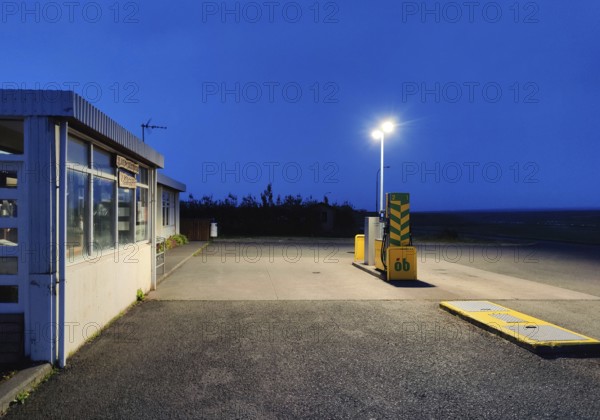 Petrol station vending machine with self-service day and night in rural surroundings in the evening, Laugarbakki, Northwest Iceland, Iceland