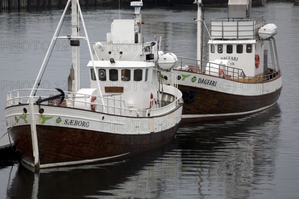 Two small ships in the harbour, Husavik, Iceland