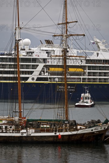 A cruise ship, a sailing ship and other ships and boats in the harbour, Husavik, Iceland