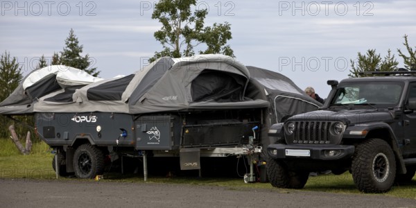 Car with tent trailer at the campsite in Vopnafjördur, East Iceland, Iceland