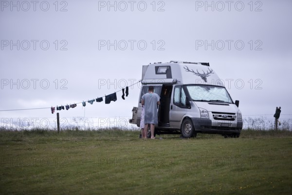 Campervan with clothesline at the campsite in Reykjadiskur at Skagafjördur, Iceland