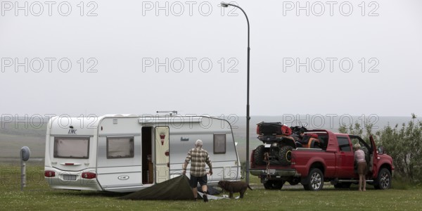 Pick-up with quad bike and caravan at the campsite in Laugarbakki, Northwest Iceland, Iceland