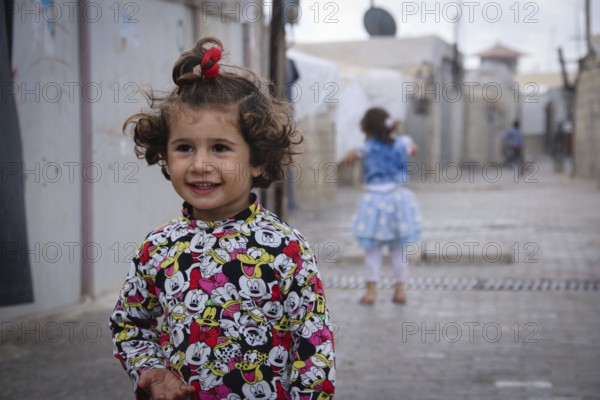A Syrian refugee child photographed in a camp, reflecting the harsh living conditions of displaced families. Aleppo, Syria March 2, 2017, Aleppo, Syria