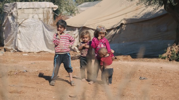 Syrian children playing in a refugee camp near the Turkish border on World Children's Day. Aleppo, Syria October 29, 2022, Aleppo, Syria