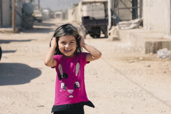A Syrian refugee child photographed in a camp, reflecting the harsh living conditions of displaced families. Aleppo, Syria. July 19, 2023, Aleppo, Syria