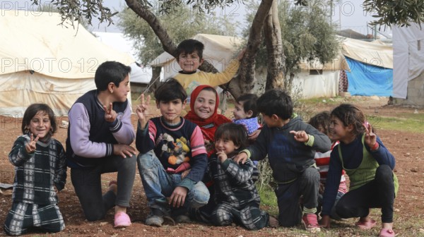 A group of Syrian refugee children gathered inside a camp. Aleppo, Syria July 3, 2015, Aleppo, Syria