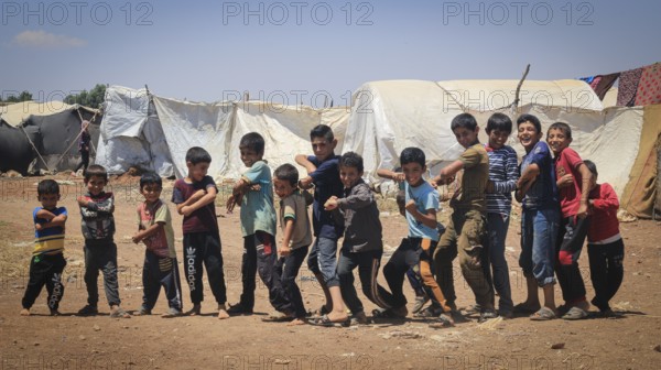 A group of Syrian refugee children gathered inside a camp. Aleppo, Syria February 1, 2015, Aleppo, Syria