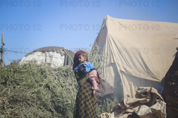 A Syrian refugee child photographed in a camp, reflecting the harsh living conditions of displaced families. Aleppo, Syria. October 29, 2022, Aleppo, Syria