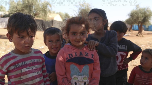 A group of Syrian refugee children gathered inside a camp. Aleppo, Syria. October 29, 2022, Aleppo, Syria
