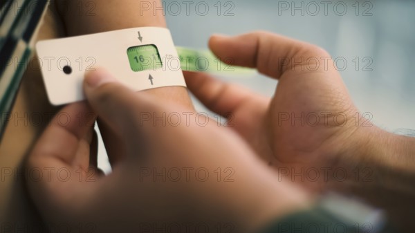 A doctor examines children's malnutrition inside a refugee camp. Malnutrition was measured using a mid-upper arm circumference belt. Aleppo, Syria October 29, 2022, Aleppo, Syria