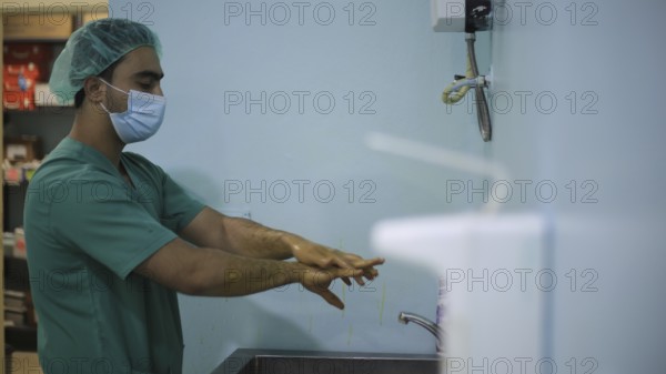 A doctor washing his hands before entering the operating room to perform surgery. Aleppo, Syria October 18, 2022, Aleppo, Syria
