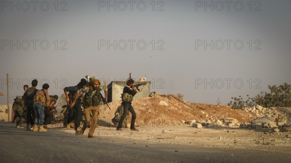 Syrian opposition fighters firing small arms and heavy weapons during the expulsion of ISIS militias from northern Syria. Aleppo, Syria October 10, 2016, Aleppo, Syria