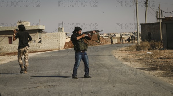 Syrian opposition fighters firing small arms and heavy weapons during the expulsion of ISIS militias from northern Syria. Aleppo, Syria October 15, 2016, Aleppo, Syria
