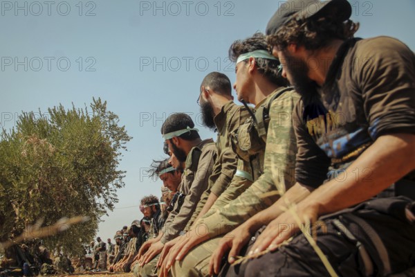 Free Syrian Army fighters praying on the battlefield during combat against terrorist organizations in northern Syria. Aleppo, Syria August 25, 2015, Aleppo, Syria