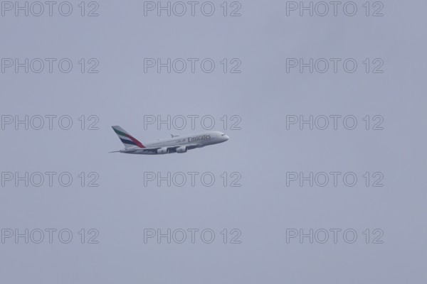 Airbus A380 jet passenger aircraft of Emirates airlines flying, England, United Kingdom