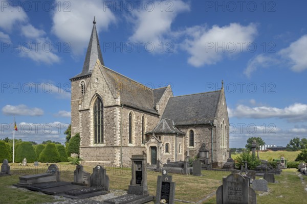 The old Sint-Pieterskerk, St. Peter's Church, now necropolis with graves of Belgian WWI soldiers buried inside at Grimde, Tienen, Tirlemont, Belgium