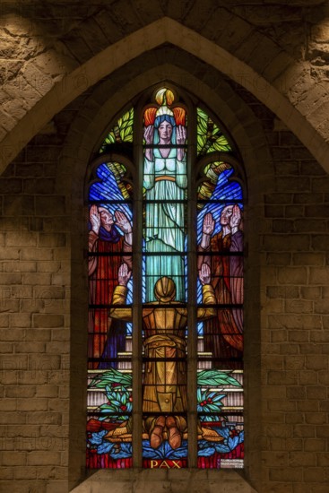 Stained glass window showing WWI Belgian soldier at World War One necropolis in the St Peter's church at Grimde near Tienen, Tirlemont, Belgium