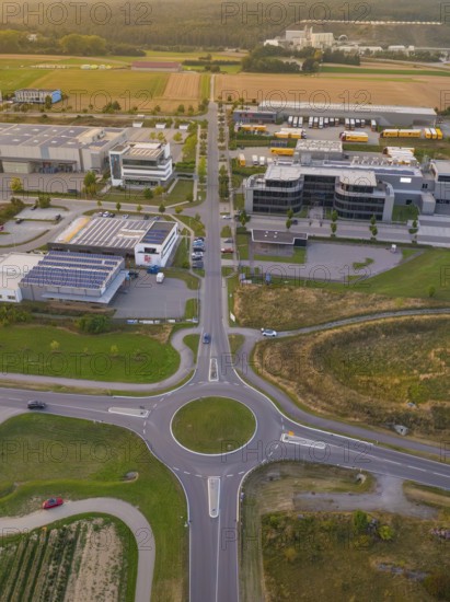 Overview of a roundabout in an industrial area, surrounded by fields and buildings, industrial area Wolfsberg Nagold, district Calw, Black Forest, Germany