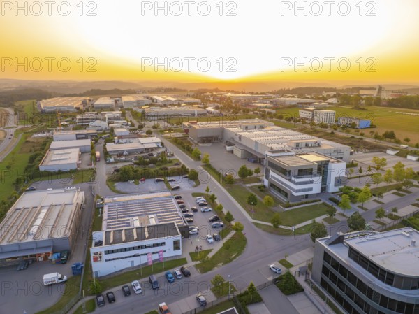 Spacious industrial estate at sunset with organised streets and modern buildings, Wolfsberg Nagold industrial area, Calw district, Black Forest, Germany