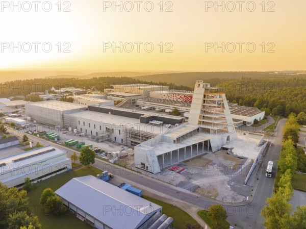 Striking modern industrial building in the surroundings of a large industrial complex at sunset, Wolfsberg Nagold industrial area, Calw district, Black Forest, Germany